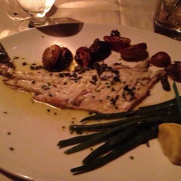 Whole roasted branzini with crispy grape leaves, olive oil, lemon & herbs - Mezze, Baltimore, MD